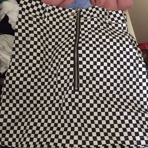 Nice checkered mini skirt! Zips in the front!